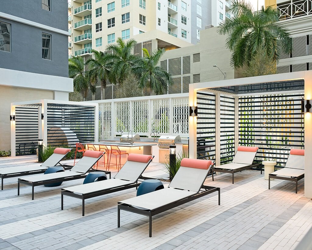Grilling area and cabanas at Coasterra Apartments in Fort Lauderdale FL