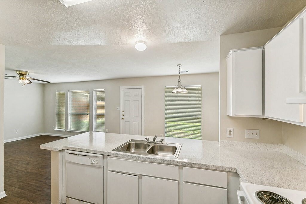 Kitchen with white cabinets at Sterling Green and Sheldon Ranch in Channelview TX