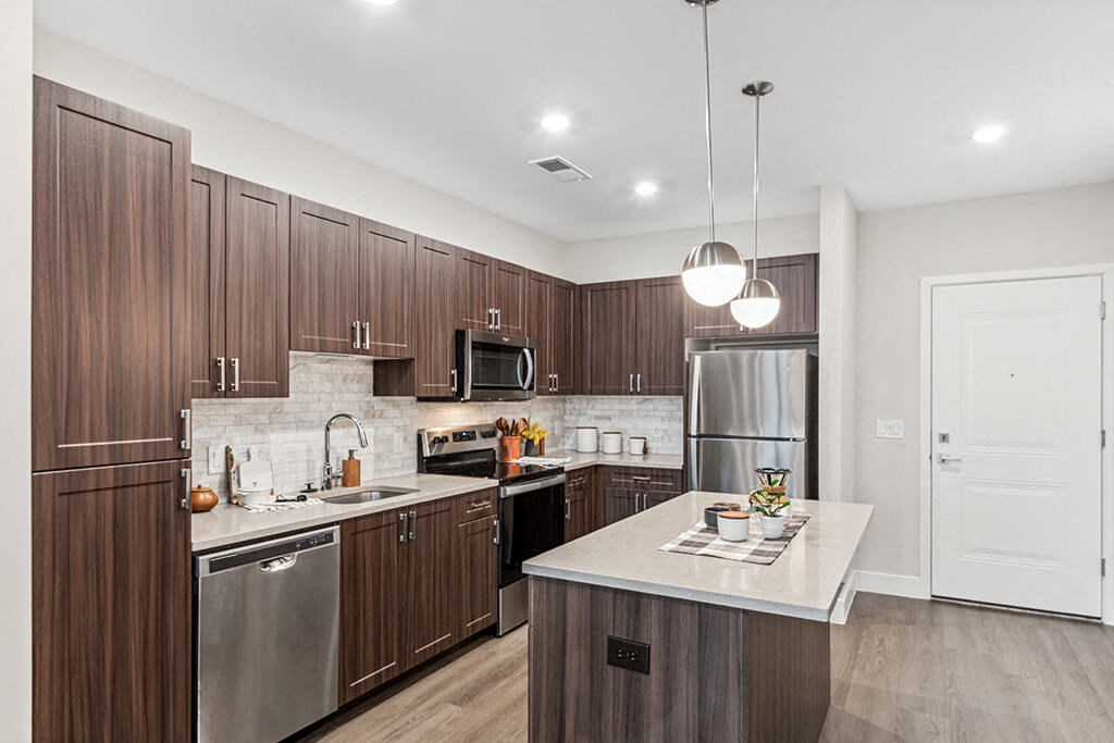 Kitchen with wood cabinets at The Moxley in Fairfax VA