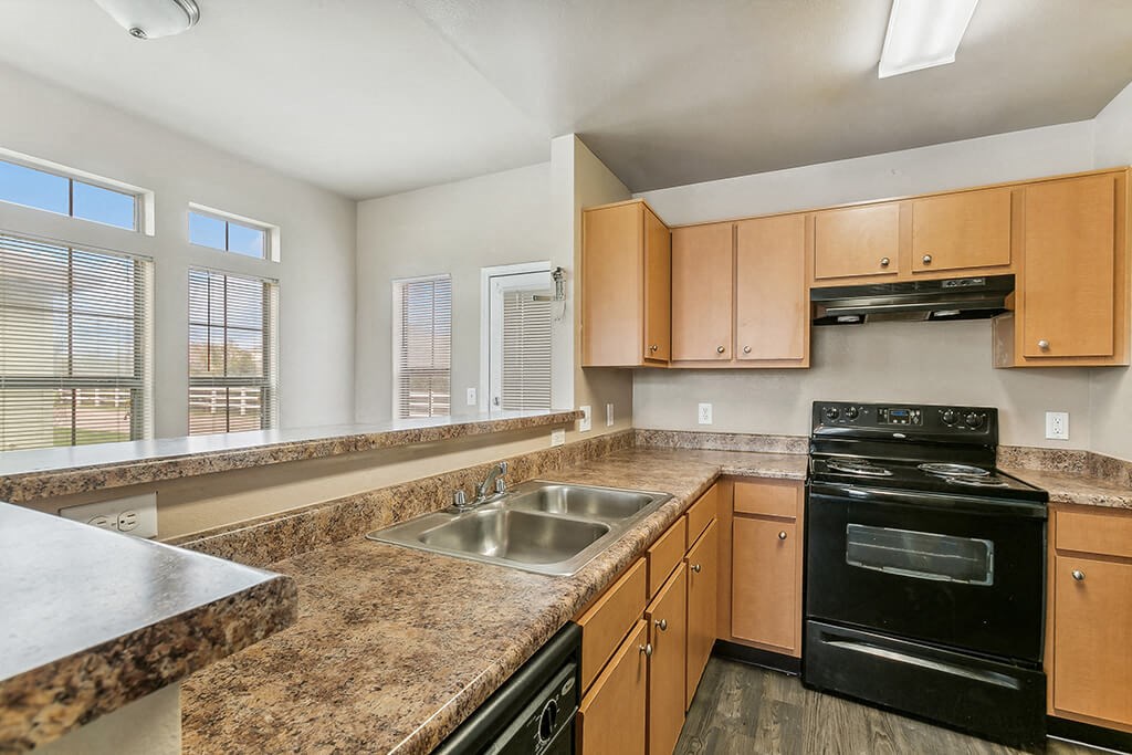 Kitchen with appliances at Sterling Green and Sheldon Ranch in Channelview TX