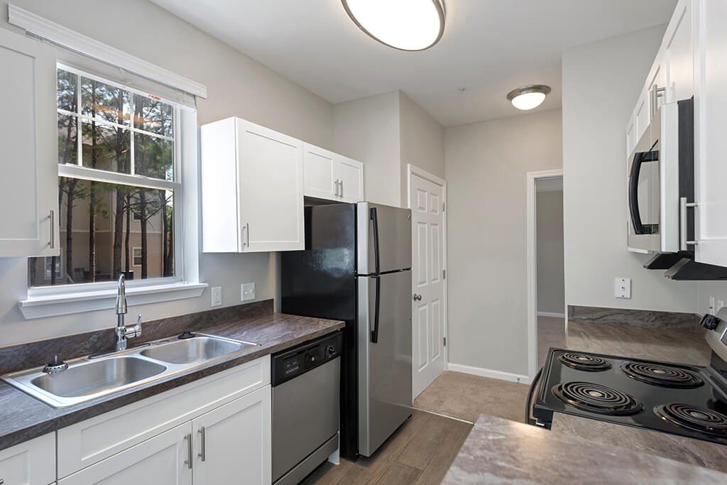 Kitchen counters at Falls Pointe at the Park Apartments in Durham NC