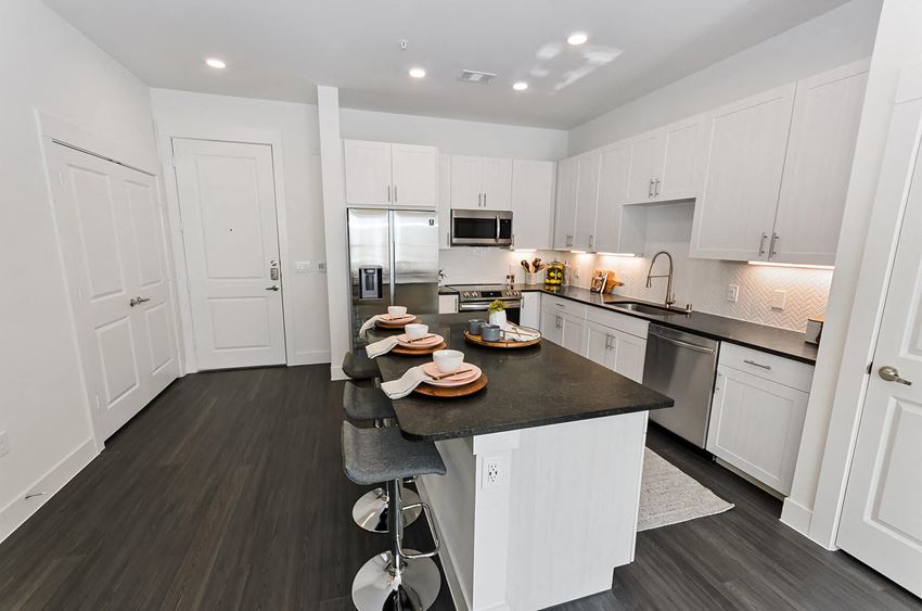 Sleek black kitchen counters at Opal Legacy Central in Plano TX - Photo Gallery