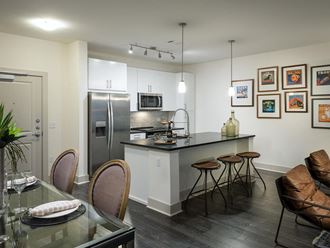 Kitchen with island seating at Cirro King of Prussia Apartments in King of Prussia PA