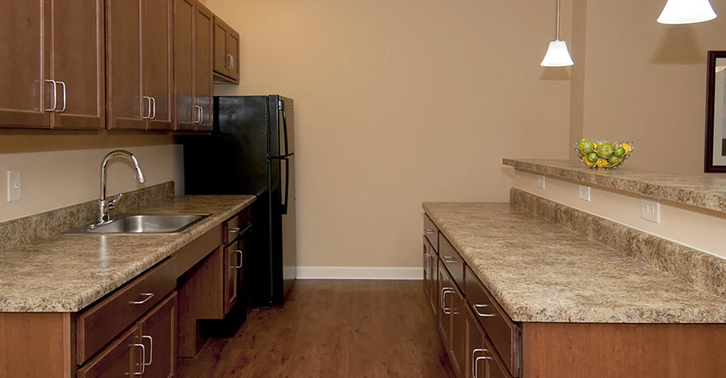 Kitchen with wood cabinets at Riverwoods, Riverwoods at Towne Square, and Riverwoods at Lake Ridge in Woodbridge VA