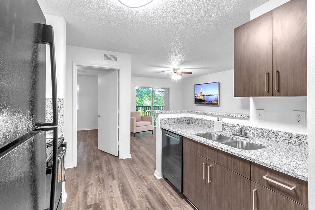 Kitchen with fridge at Cedar Grove Apartments in Miami FL