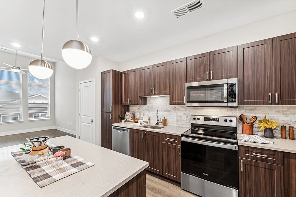 Kitchen with marble counters at The Moxley in Fairfax VA