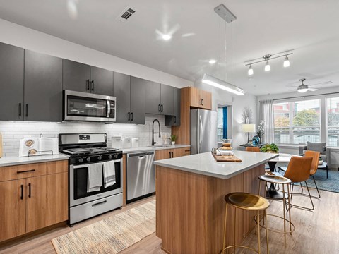 a kitchen with a large island and a stove
