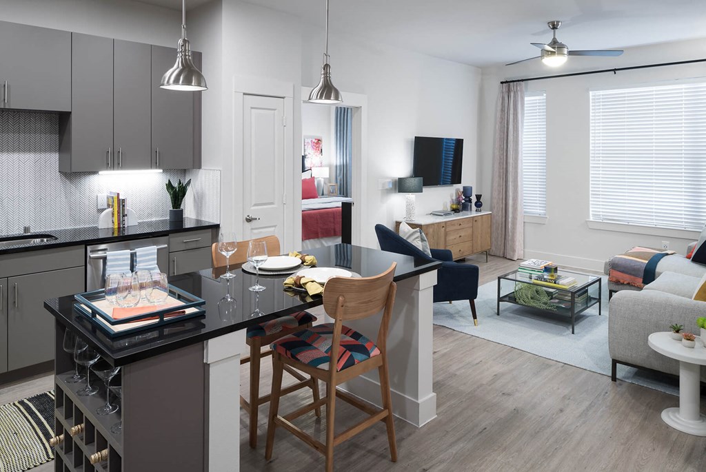 Kitchen with view of living area at Jada Legacy Central Apartments in Plano TX