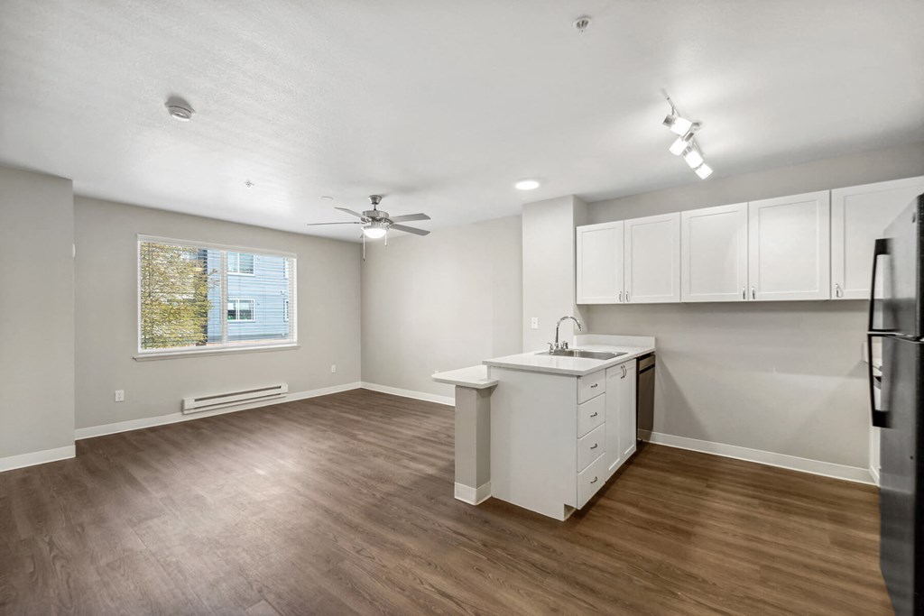 Kitchen and Living Room 3 at Auburn Court Apartments in Auburn WA