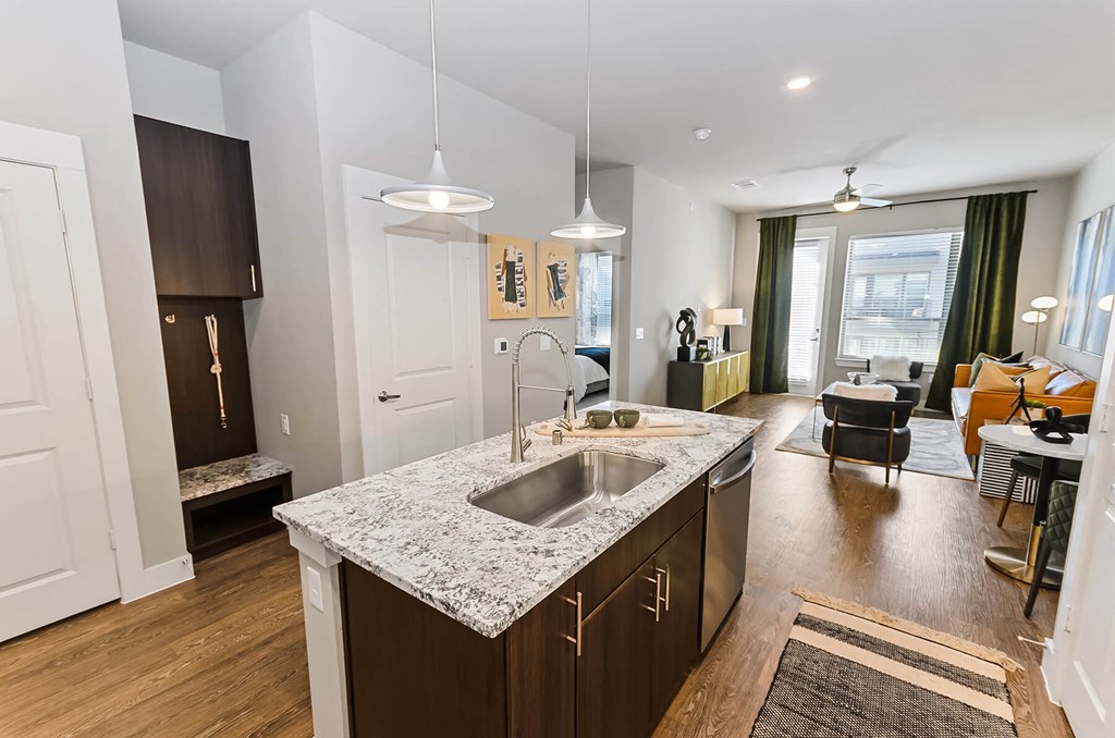 View of living room from kitchen at Opal Legacy Central in Plano TX