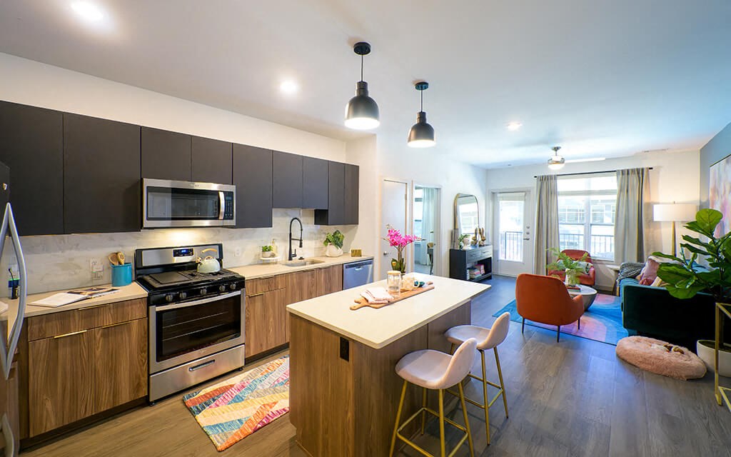 a kitchen and living room in a apartment
