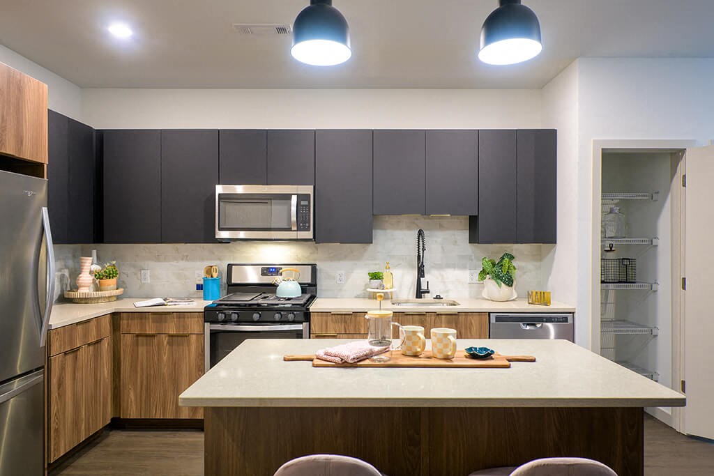 a kitchen with a white counter top