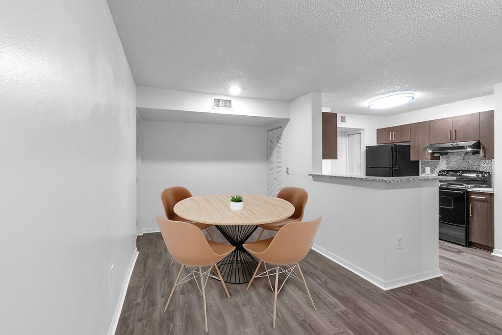 Kitchen and living room at Cedar Grove Apartments in Miami FL