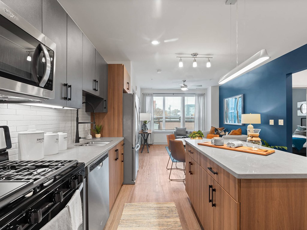 Kitchen and living room at VERO Apartments in Chelsea MA