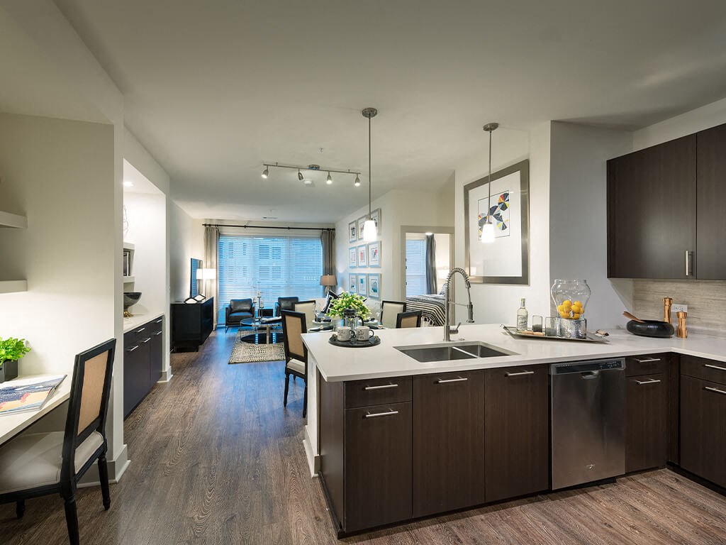 Kitchen and living room at Cirro King of Prussia Apartments in King of Prussia PA