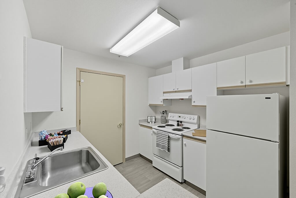 Kitchen with appliances at Alderwood Court in Lynnwood WA