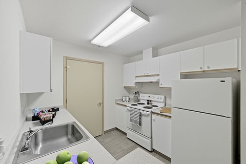 Kitchen with appliances at Alderwood Court in Lynnwood WA