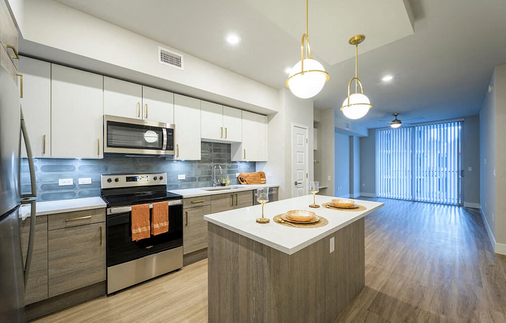 kitchen with a center island and stainless steel appliances at Treo Apartments in Fort Lauderdale FL