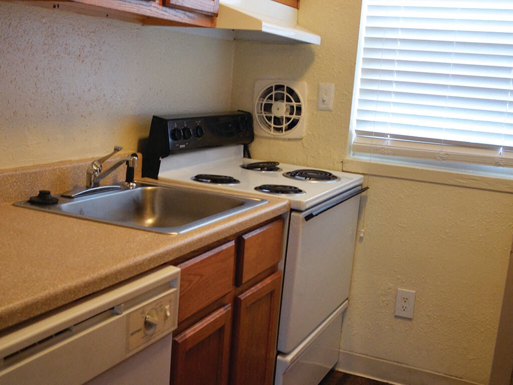 Stove and counter space at Whispering Oaks Apartments in Portsmouth VA