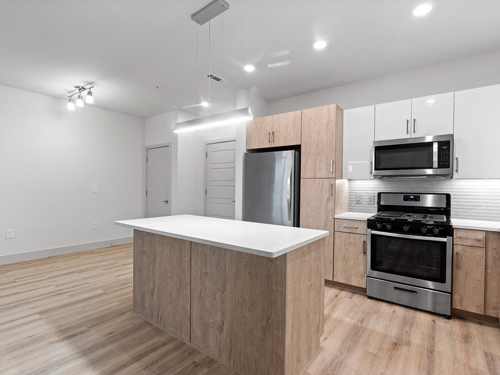 Vacant kitchen with track lighting at VERO in Chelsea MA