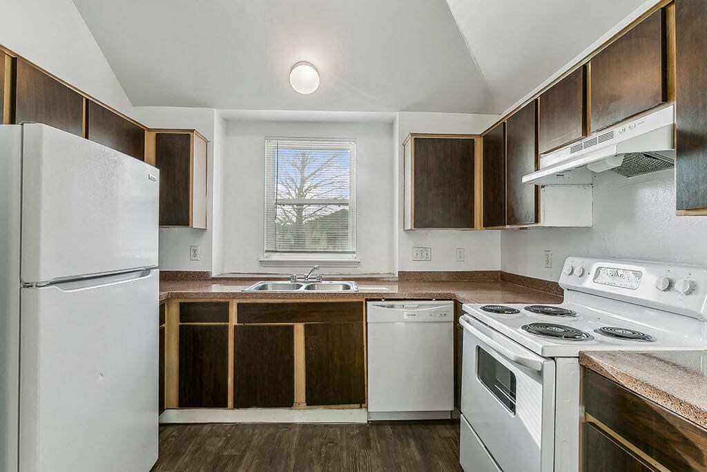 Kitchen with fridge and window at Sterling Green and Sheldon Ranch in Channelview TX