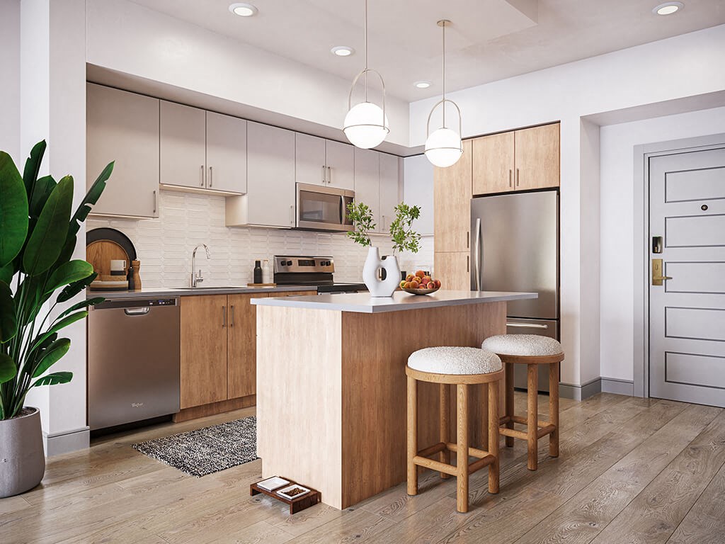 Kitchen with island seating and pendant lighting at Treo Apartments in Fort Lauderdale FL