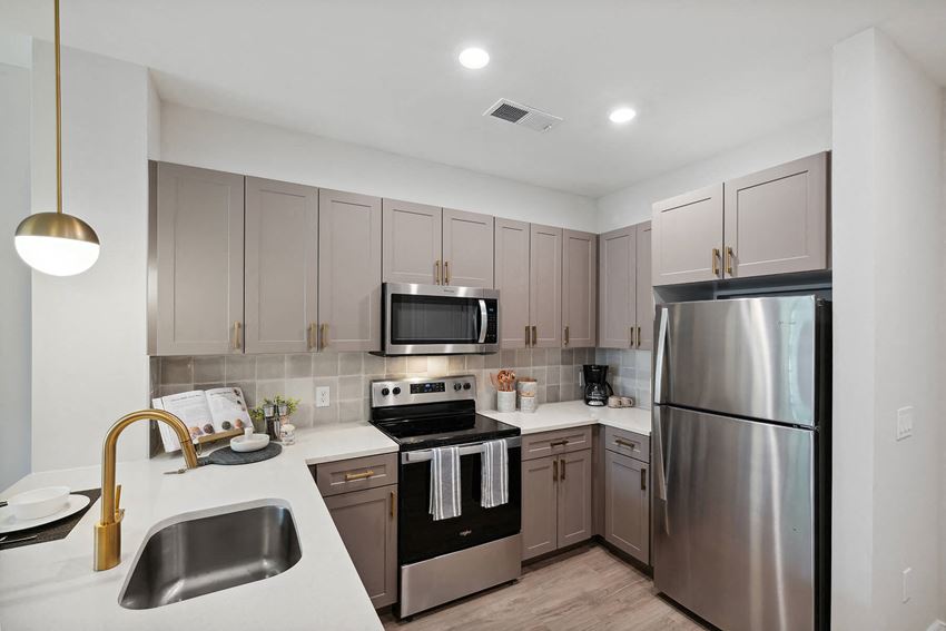 Kitchen with stainless steel appliances at The Moxley in Fairfax VA - Photo Gallery