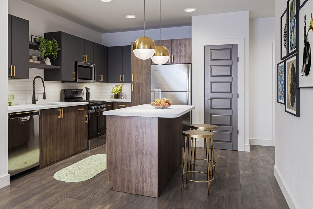 Kitchen with brass design scheme at Jayden Apartments in Peabody MA