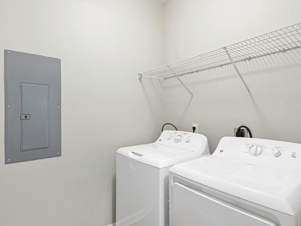 Laundry room at Falls Pointe Apartments in Durham NC