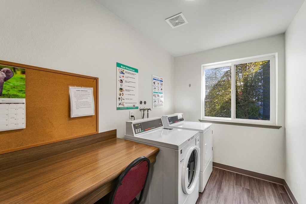 Laundry room at Auburn Court Apartments in Auburn WA