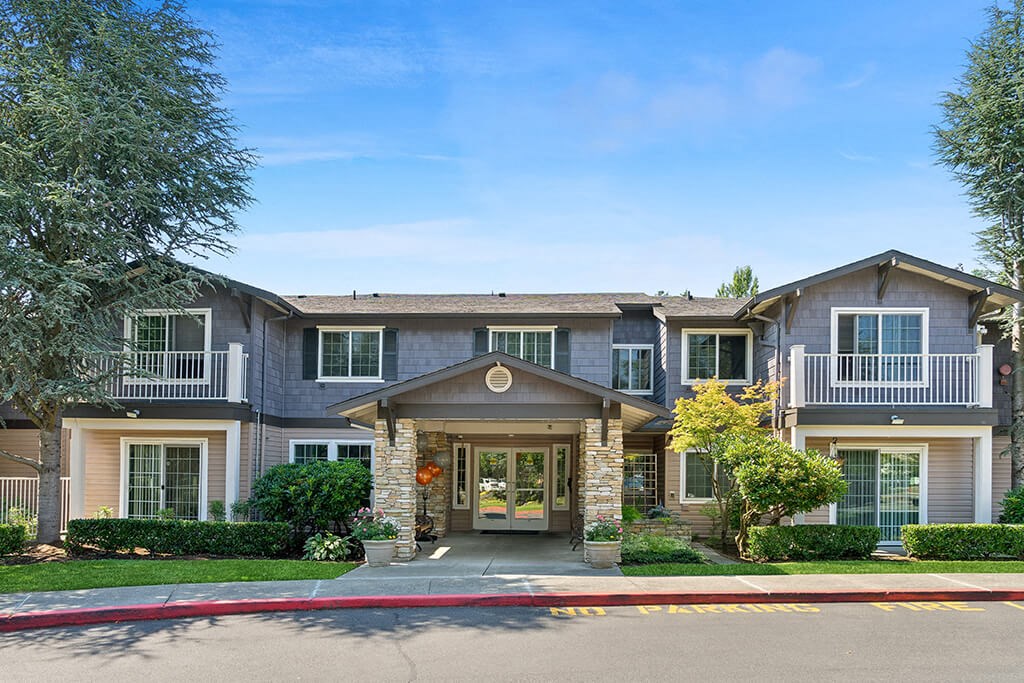 Leasing center exterior at Woodlands at Forbes Lake Apartments in Kirkland WA