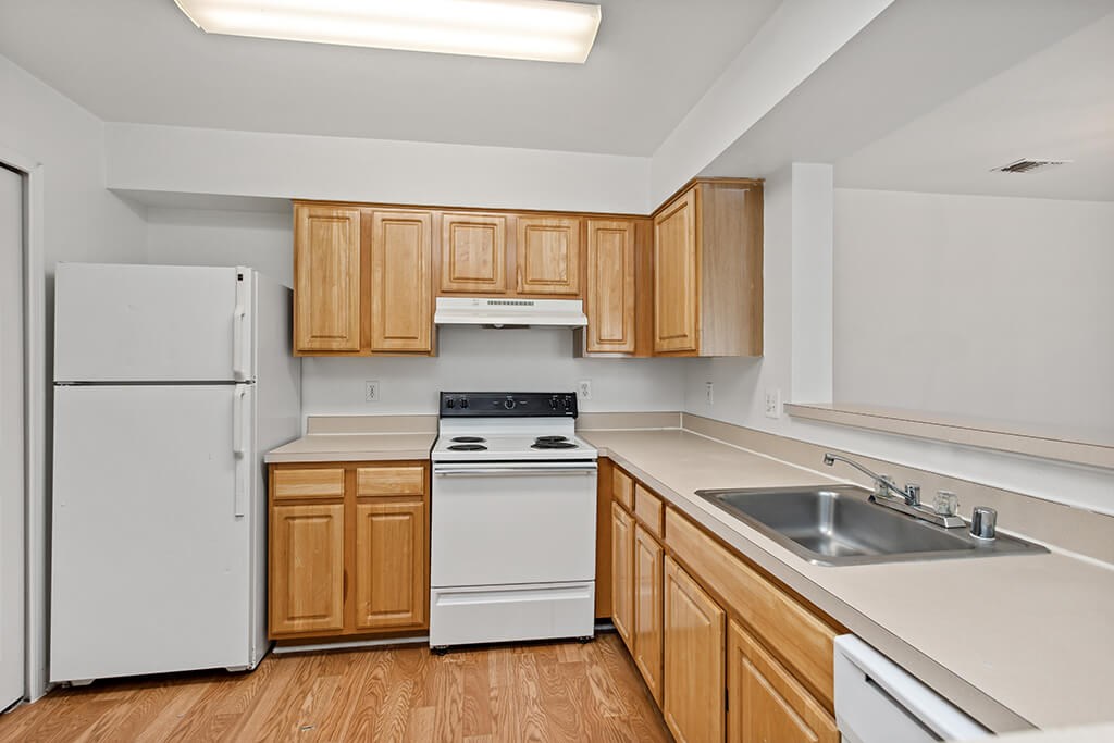 Kitchen with light wood cabinets at England Run North in Fredericksburg VA