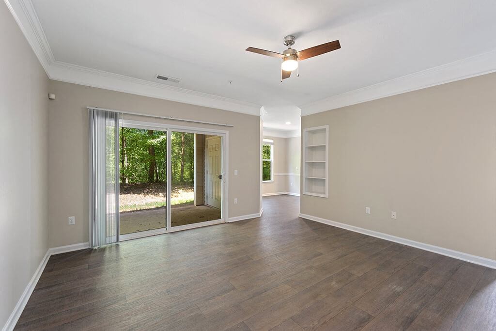Living Room with window at Falls Pointe at the Park Apartments in Durham NC