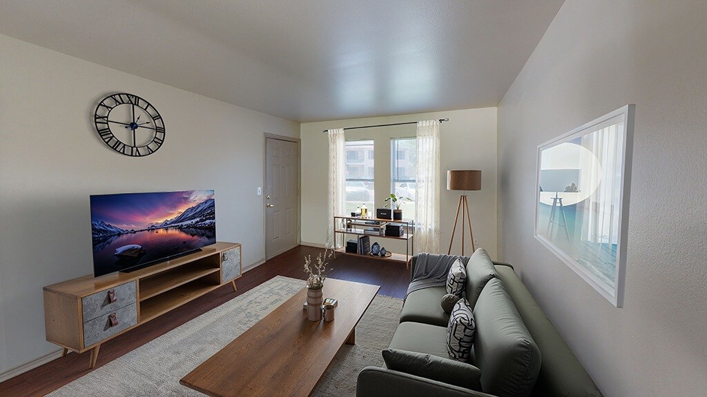 Living room with large windows at Paradise Oaks apartments in Austin TX