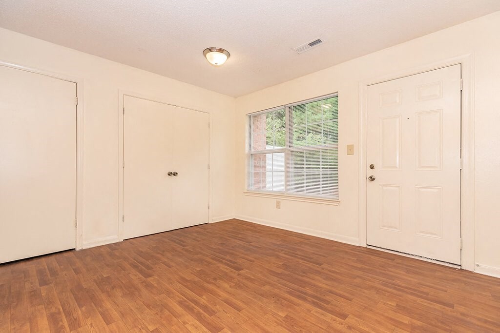 Living room with overhead lighting at Greens of Pine Glen in Durham NC