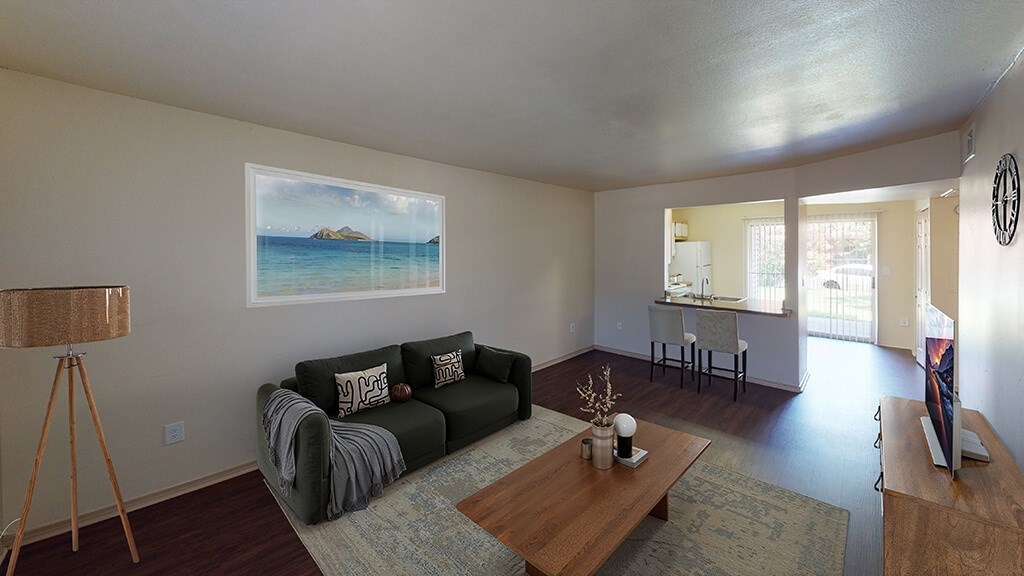 Living room with wood style flooring at Paradise Oaks apartments in Austin TX