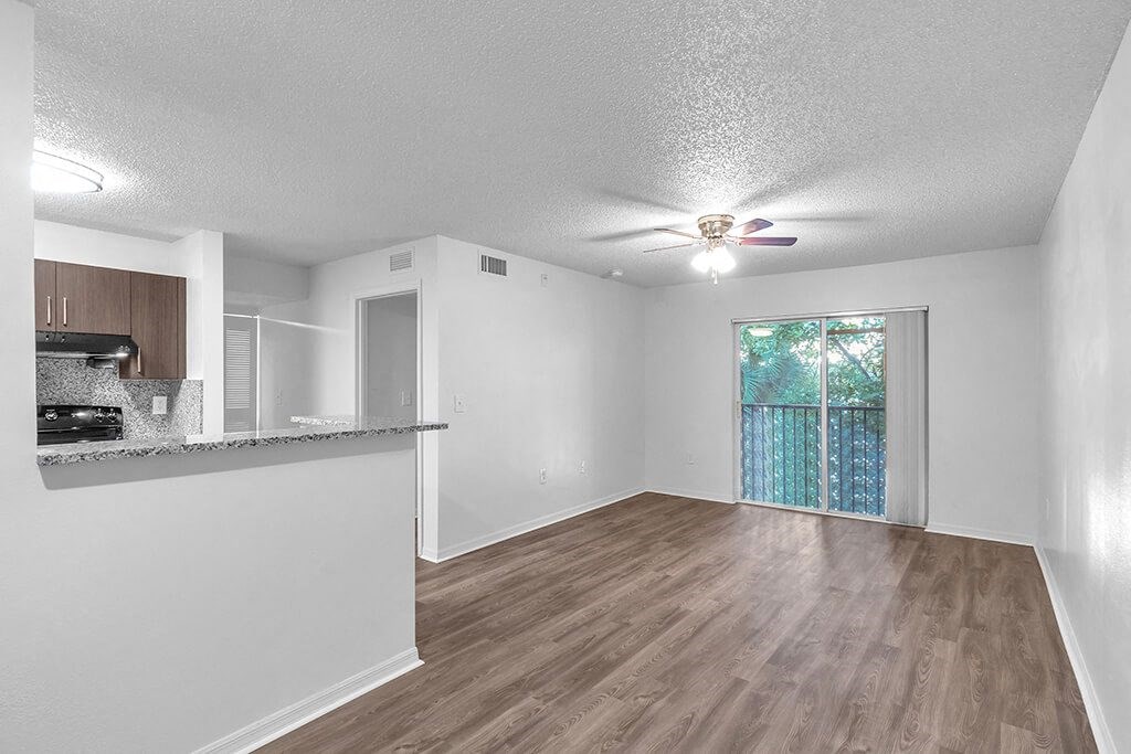View of living room and kitchen at Cedar Grove Apartments in Miami Gardens FL