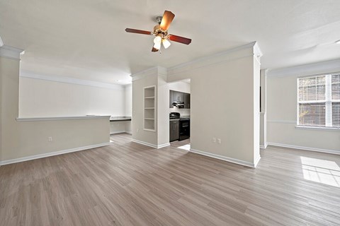 Living room with ceiling fan at Grand Oaks Apartments in Chester VA