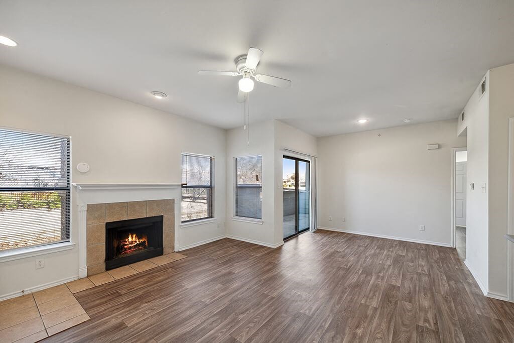Living Room with Fireplace at Tivoli apartments in Dallas TX