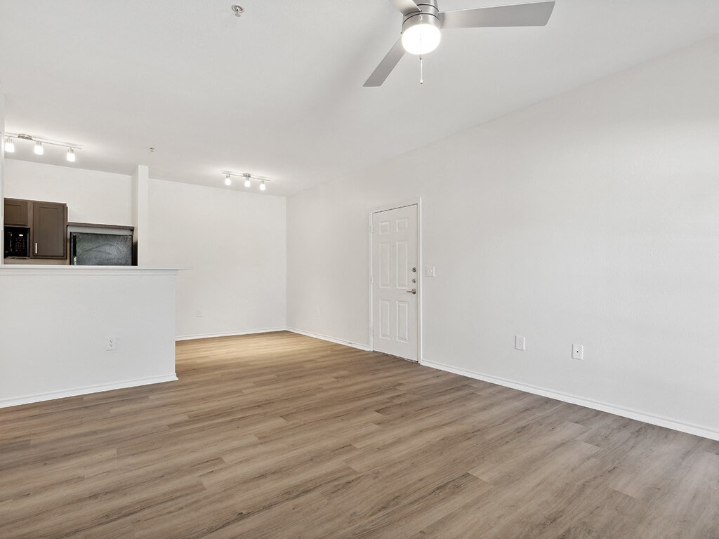 Plank flooring in Living room at Bonito Parque Apartments in San Antonio, TX