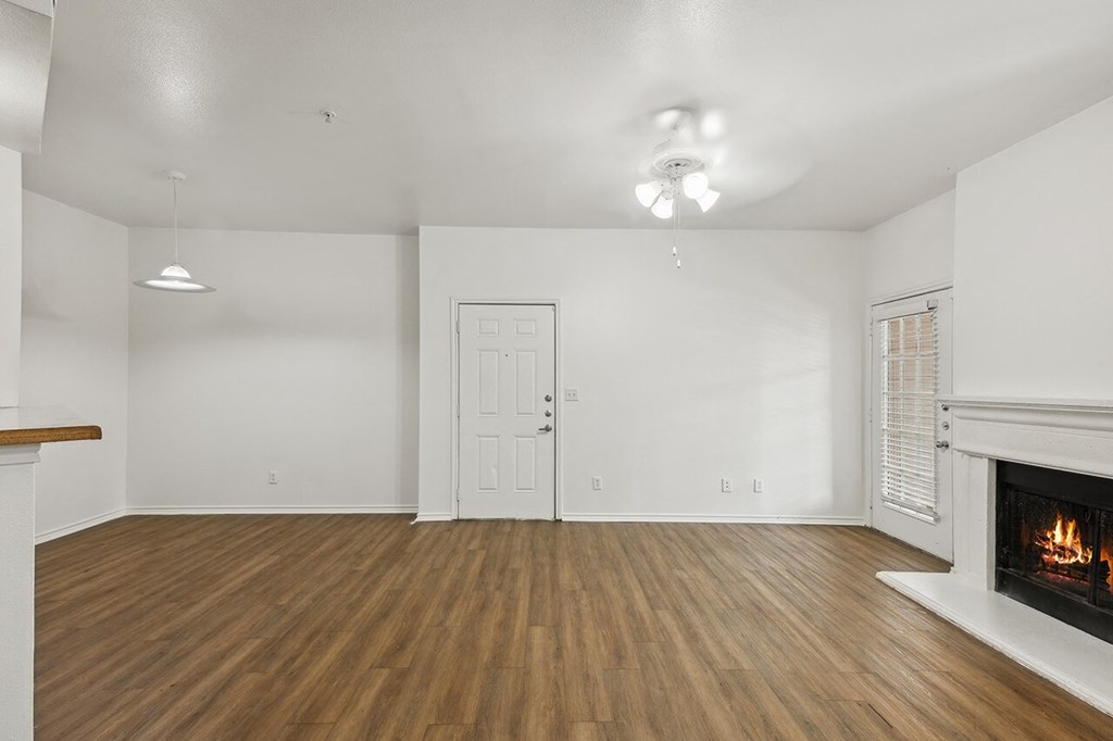 Living room with wood style flooring at Cypress View Villa Apartments in Weatherford TX