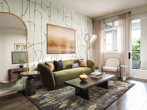A living room with a green couch and a large painting on the wall.