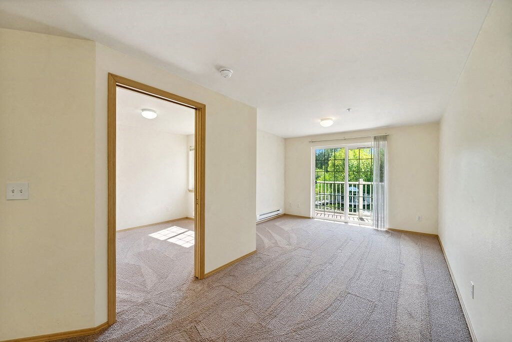 Living room at Woodlands at Forbes Lake Apartments in Kirkland WA