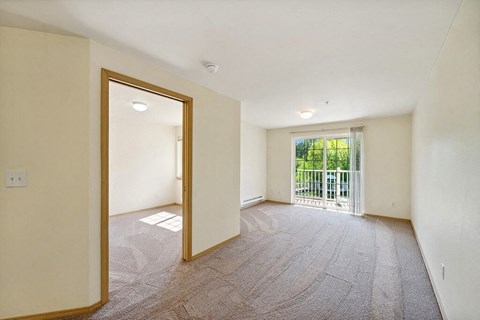 Living room at Woodlands at Forbes Lake Apartments in Kirkland WA