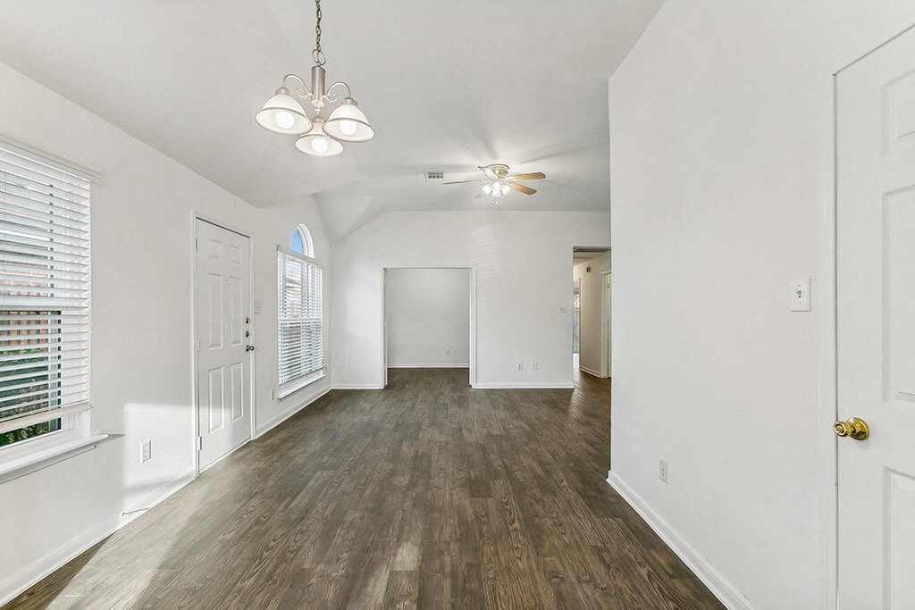 Living room with wood flooring at Sterling Green and Sheldon Ranch in Channelview TX
