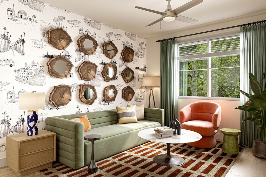 a living room with a green couch and orange chair