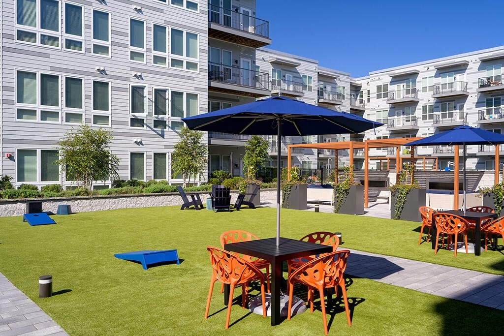 Lounge Seating and Cornhole at Vero Apartments in Chelsea MA