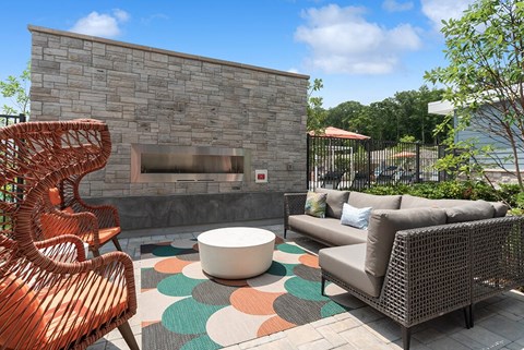 Outdoor lounge and fire place at The Quill Apartments in Milford MA
