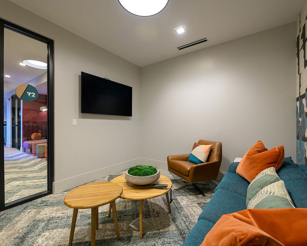 a living room with a couch and a tv