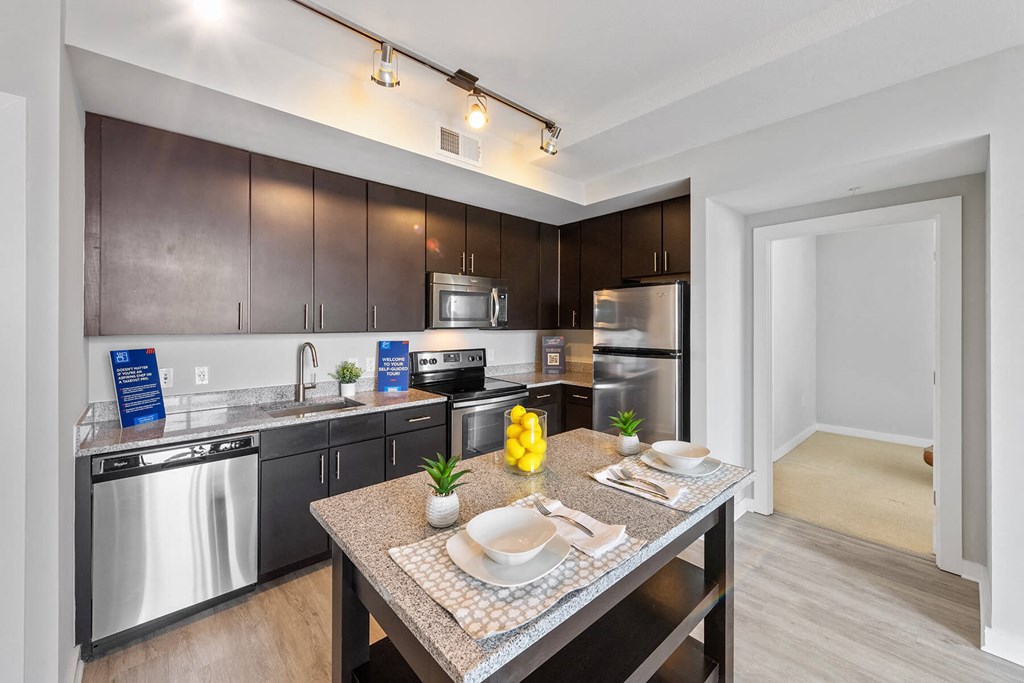Kitchen with island at Bradley Braddock Road Station Apartments in Alexandria VA